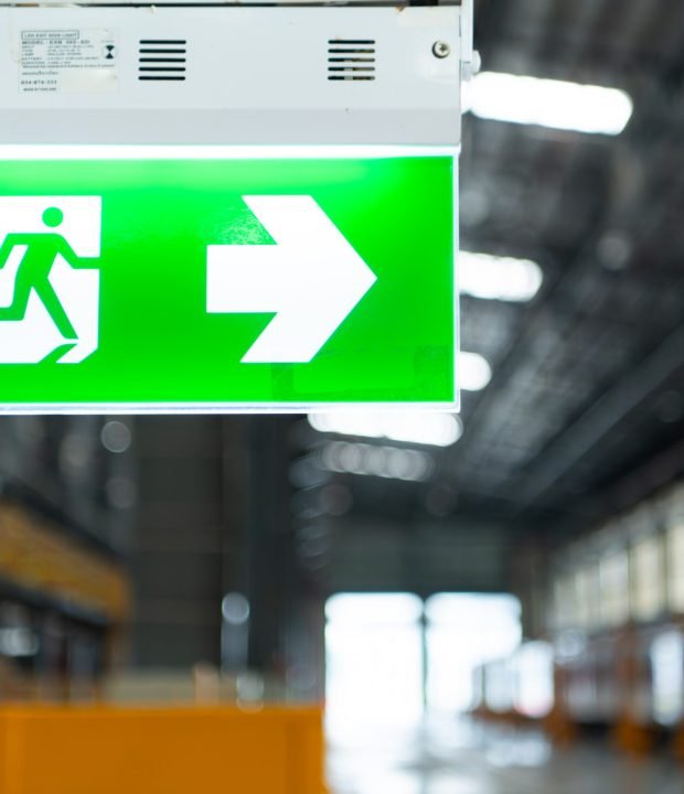 Emergency exit sign on the platform of the railway repair station.